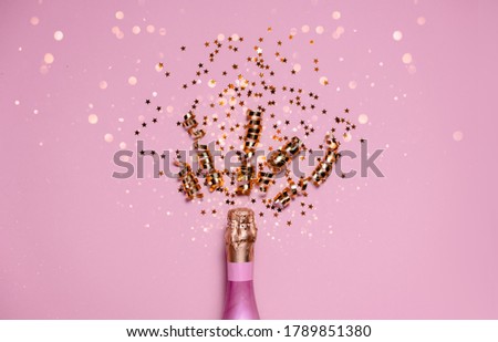 2021 golden bows pink champagne and bokeh. Top horizontal view copy space new year and holiday concept