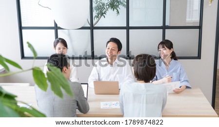Portrait of Asian men and women chatting