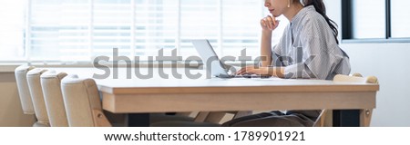 Asian woman portrait working on computer Royalty-Free Stock Photo #1789901921
