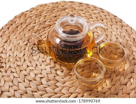 Teapot and glass cups with the famous chinese oolong tea da hong pao isolated on white background 