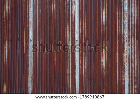 Rusted galvanized iron plate, old rusty  corrugated metallic wall texture, grunge  background
