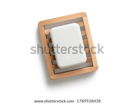 White bar of soap on wooden dish isolated on white background. Top view Royalty-Free Stock Photo #1789928438