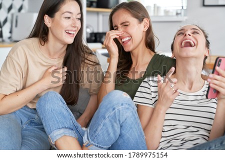 Three best friends laughing so much Royalty-Free Stock Photo #1789975154