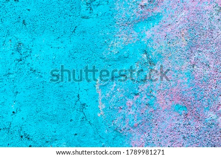 Fragment of colored graffiti painted on a wall. Bright abstract background for design. Spray urban pictures.