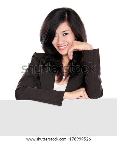 Businesswoman holding a blank presentation board isolated over background