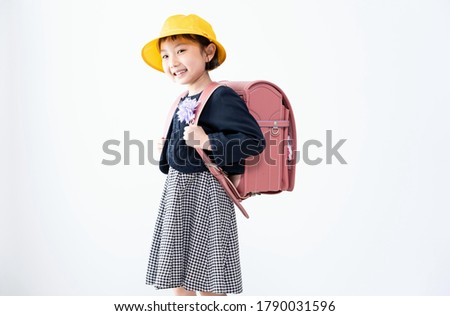 Indoor Asian elementary school student portrait Royalty-Free Stock Photo #1790031596