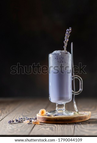 Hot latte, cappuccino with lavender on wooden table. Good Morning concept. Selective focus. Copy space
