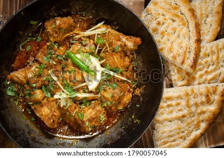 Pakistani Chicken Karahi with naan in traditional dish Royalty-Free Stock Photo #1790057045