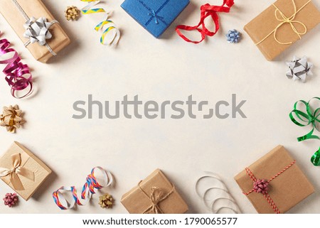 Gift Wrapping. A bright background with packaging accessories and gifts. Creative composition. Place for description. Top view.