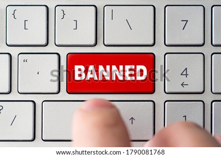 admin bans the user. The red button on the keyboard of a notebook with the inscription of banned. The concept of blocking in the Internet Royalty-Free Stock Photo #1790081768
