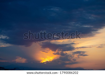 sky with dramatic clouds in the last rays of sunset