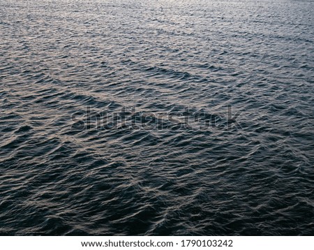 calm waves on the english sea. Blue grey water