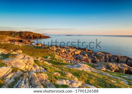 Sunset ove the coastline at Huisinis on the Isle of Harris in the Outer Hebrides of Scotland Royalty-Free Stock Photo #1790126588