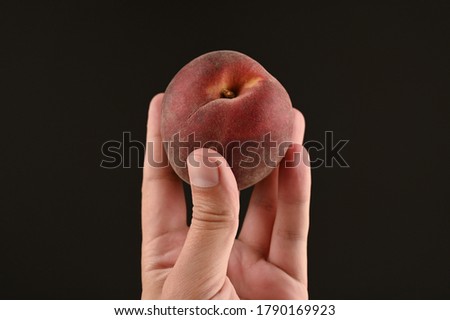 peach raised up. on isolated black background