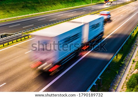 Trucks on six lane controlled-access highway in Poland.
 Royalty-Free Stock Photo #1790189732