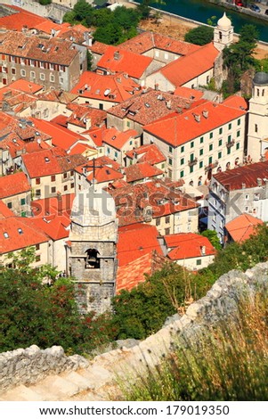 House roofs and church tower inside old town of Kotor 