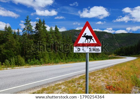 Moose warning sign at a mountain road in Setesdal valley in Agder county, Norway.