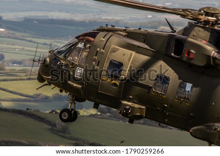 Military Helicopter Merlin EH101 flying on a training mission. Royalty-Free Stock Photo #1790259266
