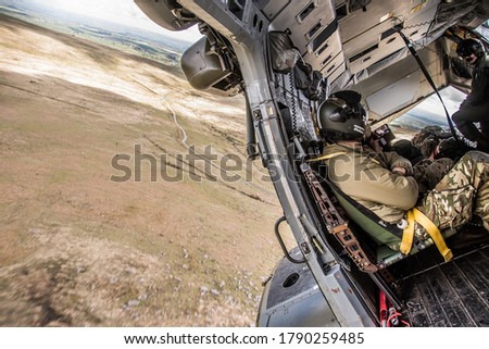 Military Helicopter Merlin EH101 cockpit on a training mission. Royalty-Free Stock Photo #1790259485