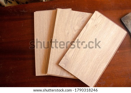 Pieces of laminate on the floor.