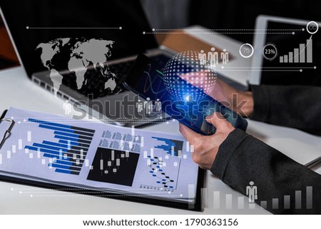 Double exposure of businesswoman working on tablet and laptop with digital marketing virtual chart, Abstract icon, Business strategy concept, Background toned image blurred.