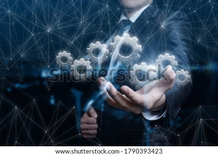 The manager shows the mechanism of business management on a dark background.
