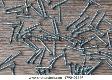 Wood screws scattered on the table. 