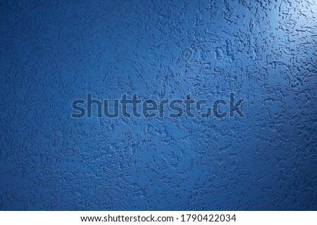 Light blue short beam of light on blue structural background with patterns