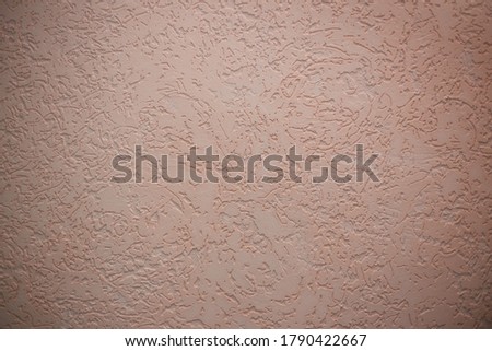 Dark cream textured background with pink shades and patterns