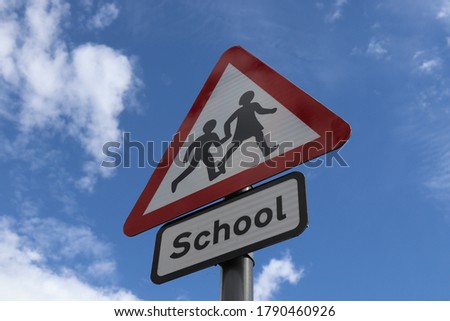 A school sign from below, on a nice sunny day