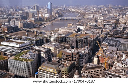 An aerial view of London, UK along the River Thames.
