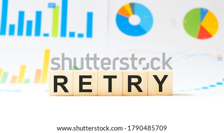 Word RETRY made with wood building blocks