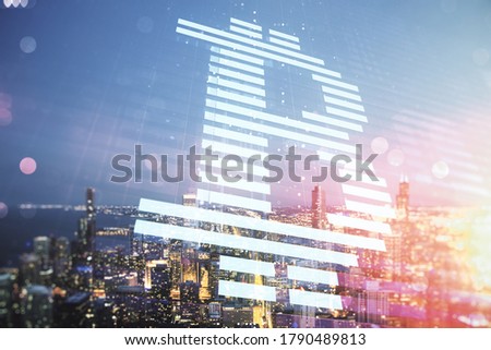 Double exposure of creative Bitcoin symbol hologram on Chicago city skyscrapers background. Cryptocurrency concept
