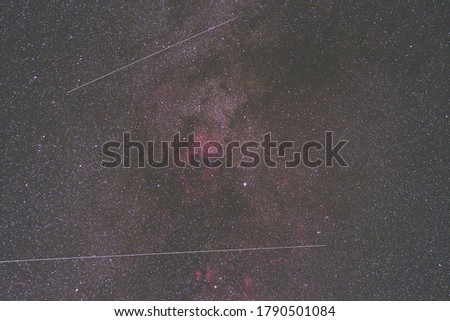 Milky Way and satellite  in the night sky.