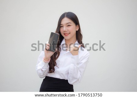 portrait of thai adult office girl show her phone and smile