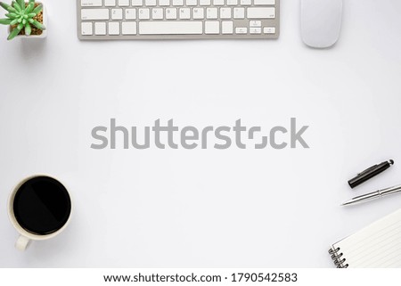 White office desk table with keyboard, notebook and coffee cup with equipment other office supplies. Business and finance concept. Workplace, Flat lay with blank copy space, top view.