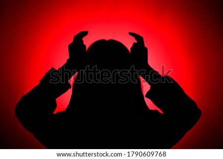 Devil hand silhouette With red background 