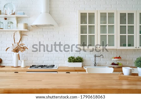 Kitchen wooden table top and kitchen blur background interior style scandinavian Royalty-Free Stock Photo #1790618063