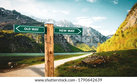 Street Sign the Direction Wy to NEW WAY versus OLD WAY Royalty-Free Stock Photo #1790642639