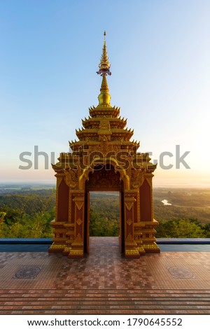 Scenic view of Pra That Doi Pra Chan temple with beautiful view of moutain and misty in sunrise at Lampang, An ancient temple decorated with ancient Lanna art named Lampang Province, Thailand.
