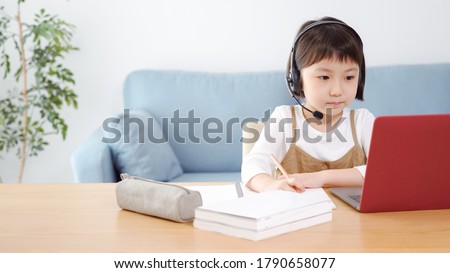 Asian girl studying in the living room