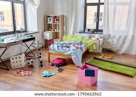 mess, disorder and interior concept - view of messy home kid's room with scattered stuff Royalty-Free Stock Photo #1790662862