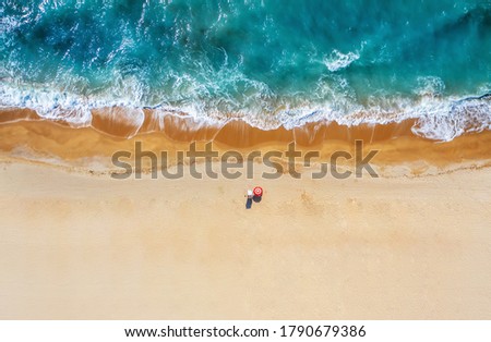 Tropical beach with colorful umbrellas. Picture with drone!