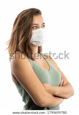 Young woman wearing medical face mask, studio portrait.Woman wearing surgical mask for corona virus