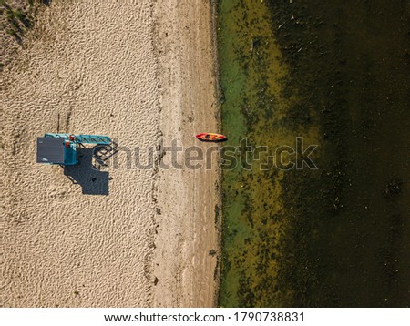 Aerial drone view. A boat on sandy beach on the Dnieper River in Kiev.