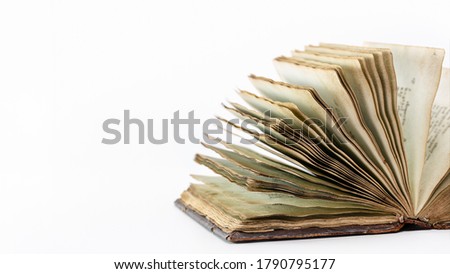 Old open book isolated on white background, studio shot.