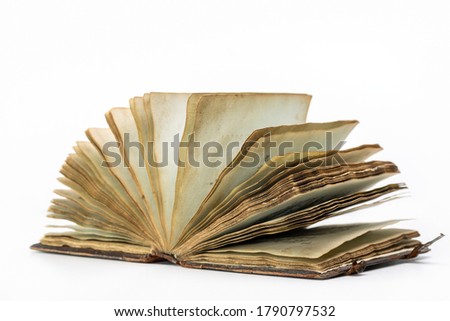  Old open book isolated on white background, close-up.