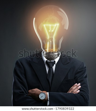 Businessman with Glowing Light Bulb Head Concept. Brilliant Idea Concept      