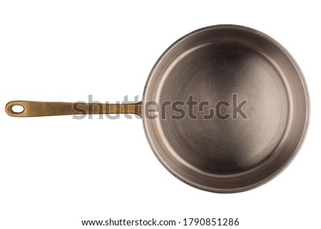 top view closeup of old aluminum cooking pan with copper metallic handle isolated on white background Royalty-Free Stock Photo #1790851286