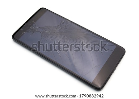 Cracked mobile smartphone isolated on white background